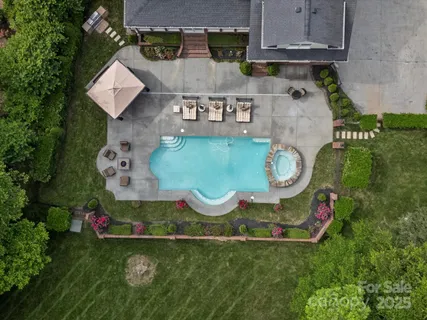 an aerial view of a house with outdoor space
