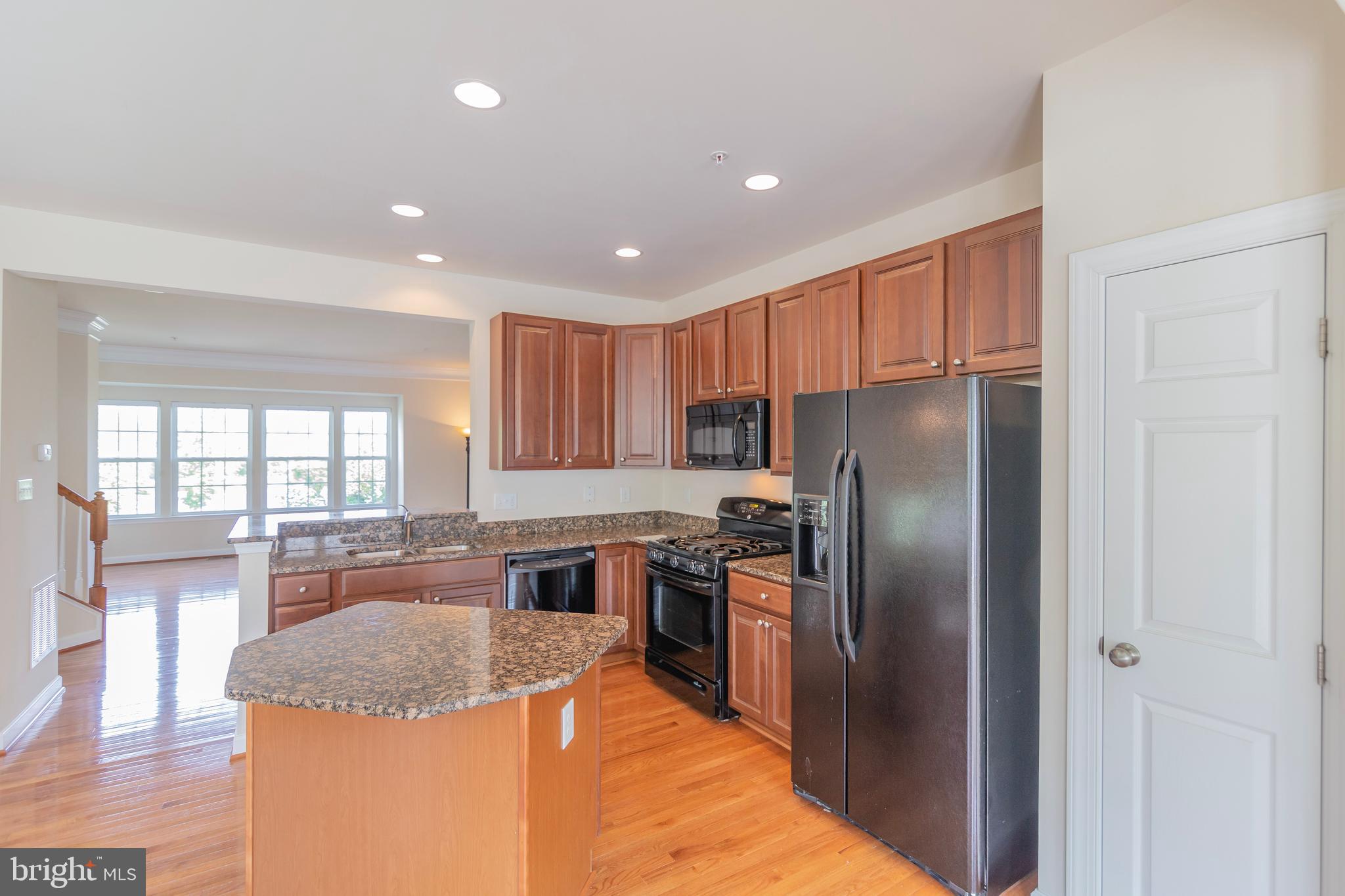 2000 Spring Run Circle Frederick, MD 21702 - Photo 21 of 49 ISLAND KITCHEN WITH WOOD FLOORS