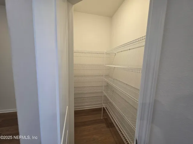 a view of a room with racks on the wall