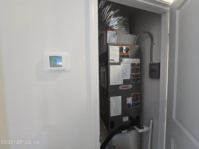 a view of kitchen with wooden floor and electronic appliances