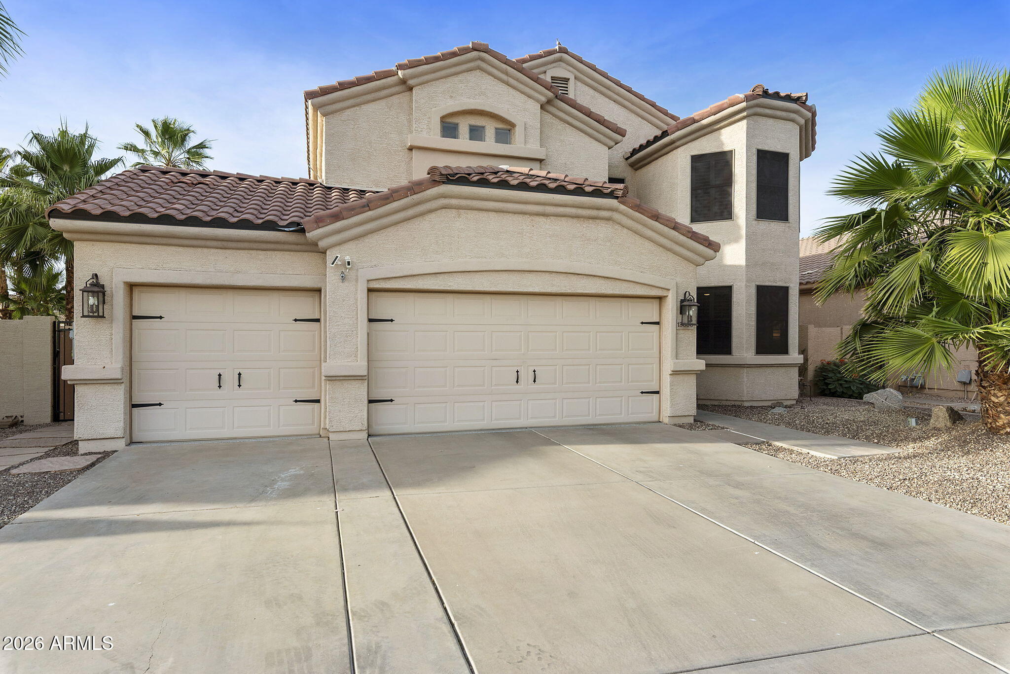 13660 West Monte Vista Road Goodyear, AZ 85395 - Photo 2 of 75 FRONT OF HOME W/3 CAR GARAGE