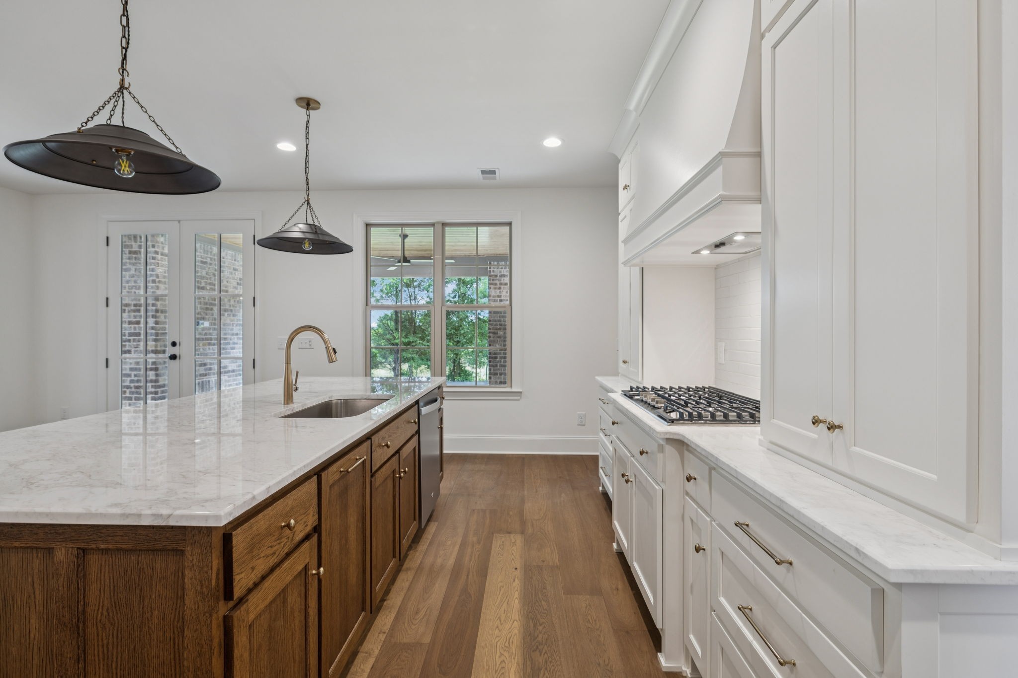 217 Bellsford Road Gallatin, TN 37066 - Photo 26 of 73 a kitchen with granite countertop a sink a counter space appliances and cabinets