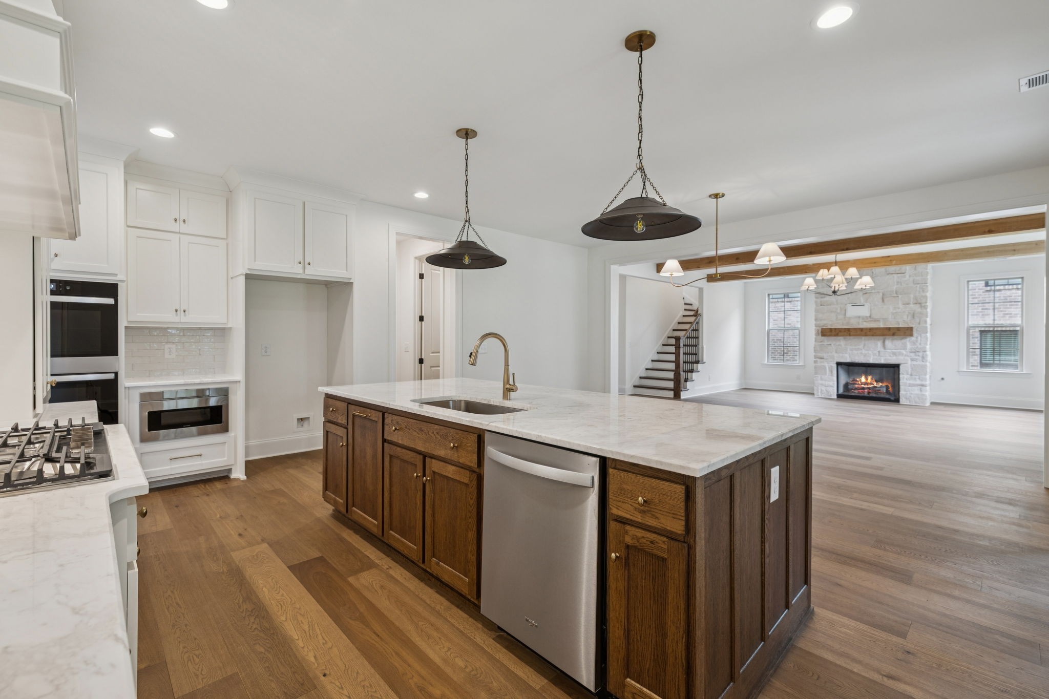 217 Bellsford Road Gallatin, TN 37066 - Photo 28 of 73 a kitchen with stainless steel appliances granite countertop a sink a stove and a wooden floors