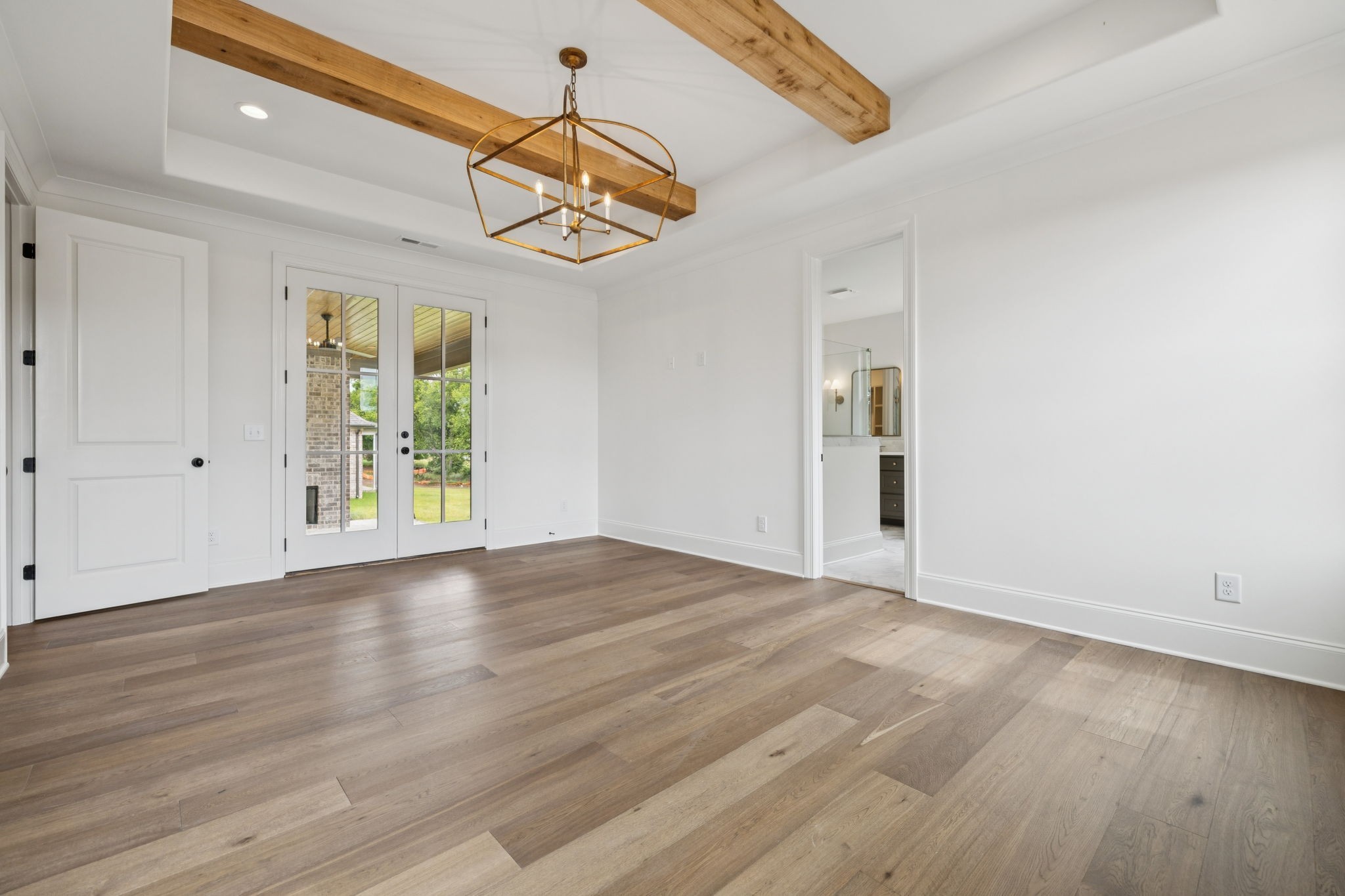 217 Bellsford Road Gallatin, TN 37066 - Photo 32 of 73 a view of an empty room with wooden floor and a window