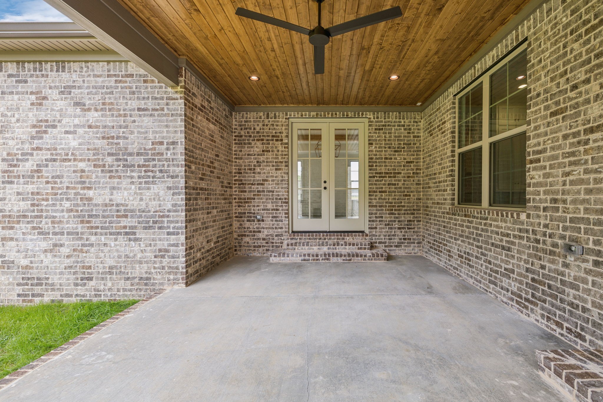 217 Bellsford Road Gallatin, TN 37066 - Photo 62 of 73 a view of an empty room with a brick wall and a window