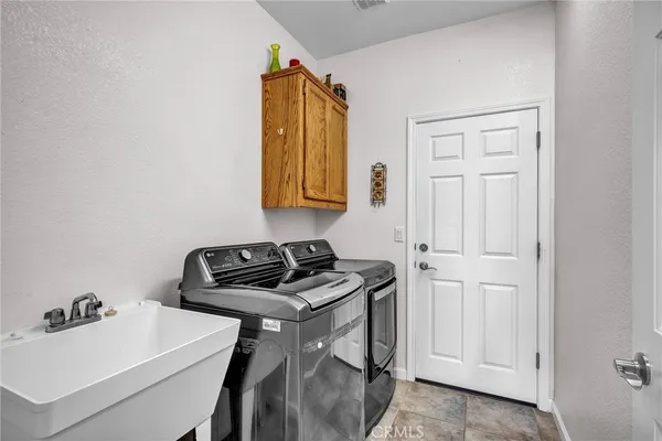 a bathroom with a sink a vanity and window