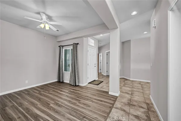 a view of a hallway with a chandelier