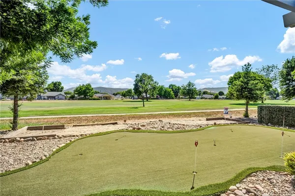 a view of a swimming pool and a yard