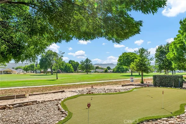 a view of a swimming pool with a yard
