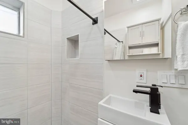a kitchen with stainless steel appliances granite countertop white cabinets