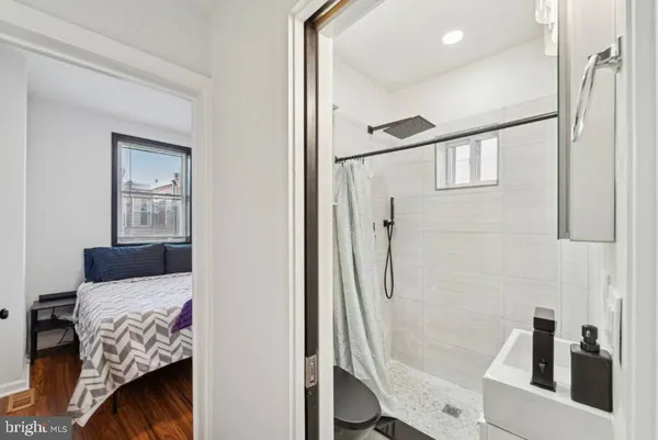 a bedroom with a bed and a rug