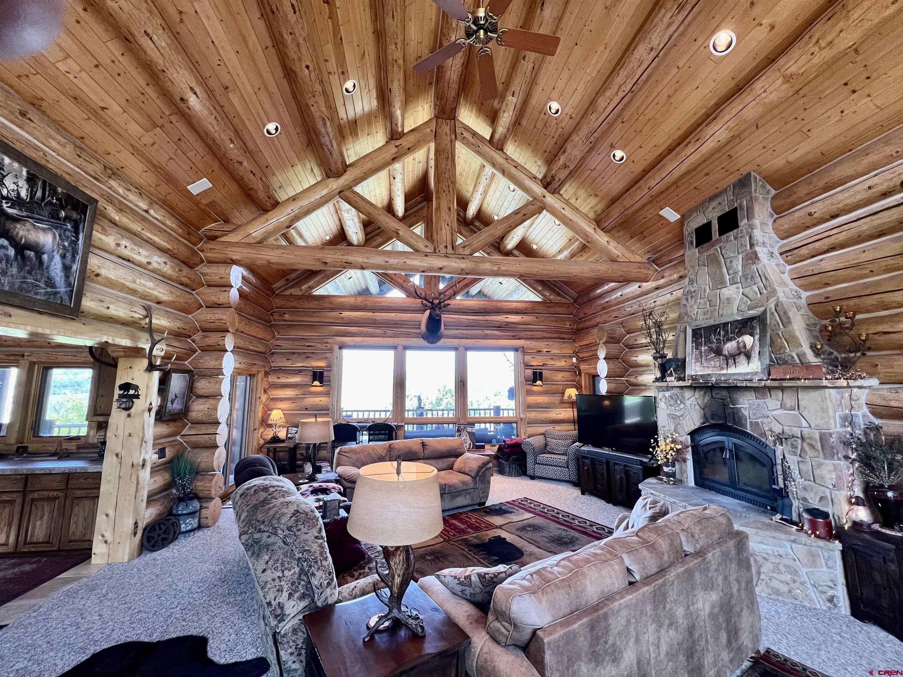1329 B Spg Vly Rnch Road, Unit ELK HAVEN Chromo, CO 81128 - Photo 13 of 33 a outdoor space with lots of tables a chandelier and couches