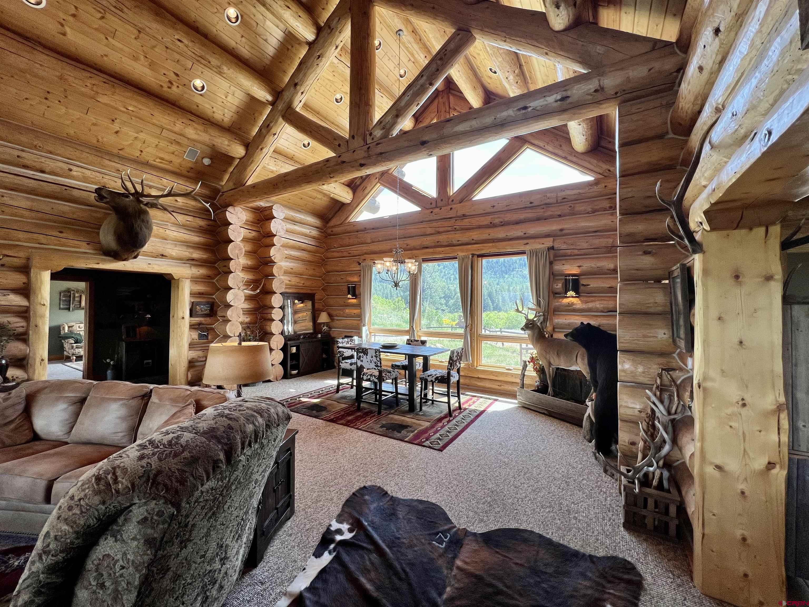 1329 B Spg Vly Rnch Road, Unit ELK HAVEN Chromo, CO 81128 - Photo 15 of 33 a living room with furniture and a fireplace