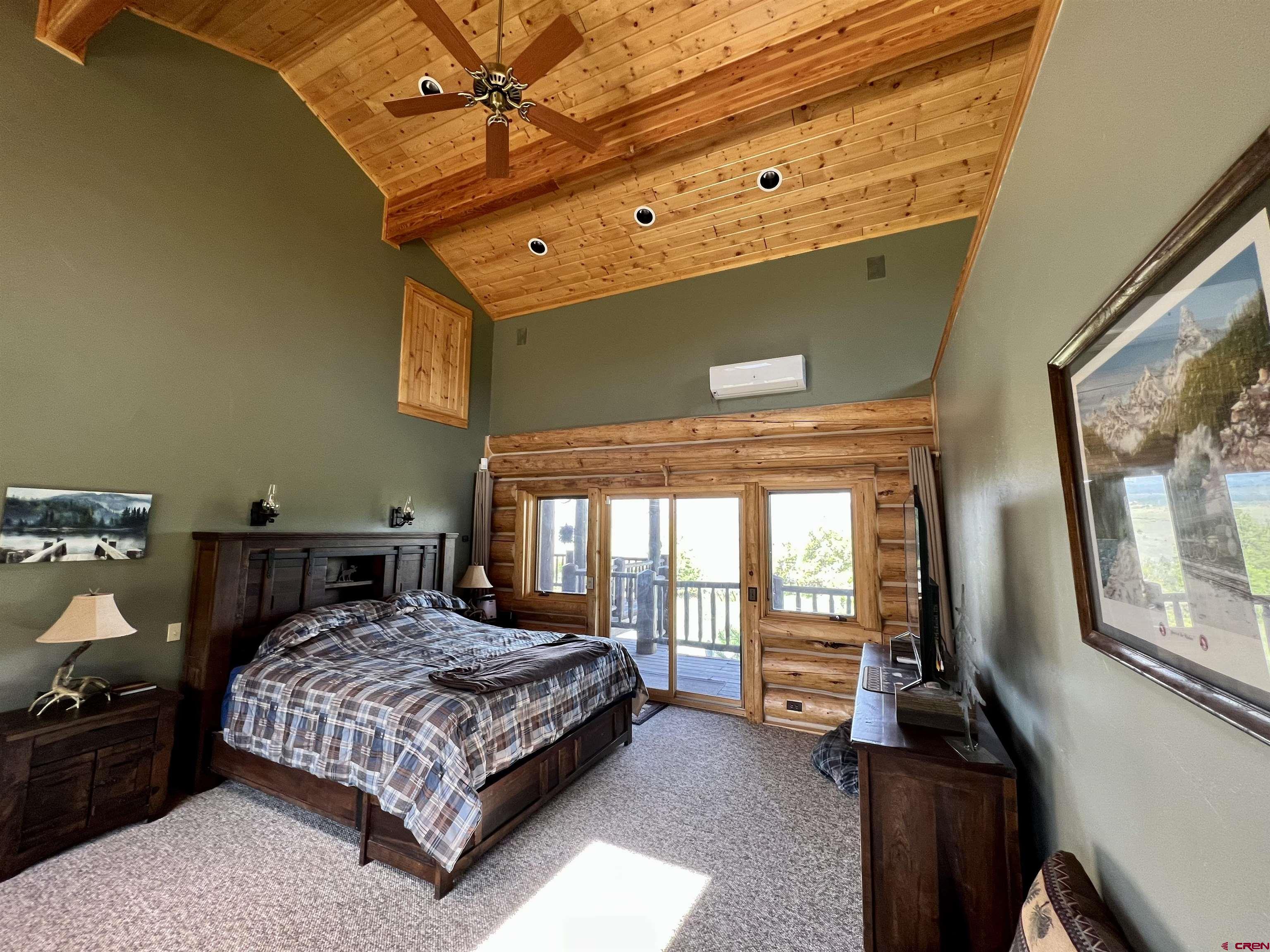 1329 B Spg Vly Rnch Road, Unit ELK HAVEN Chromo, CO 81128 - Photo 16 of 33 a bedroom with a bed and wooden floor