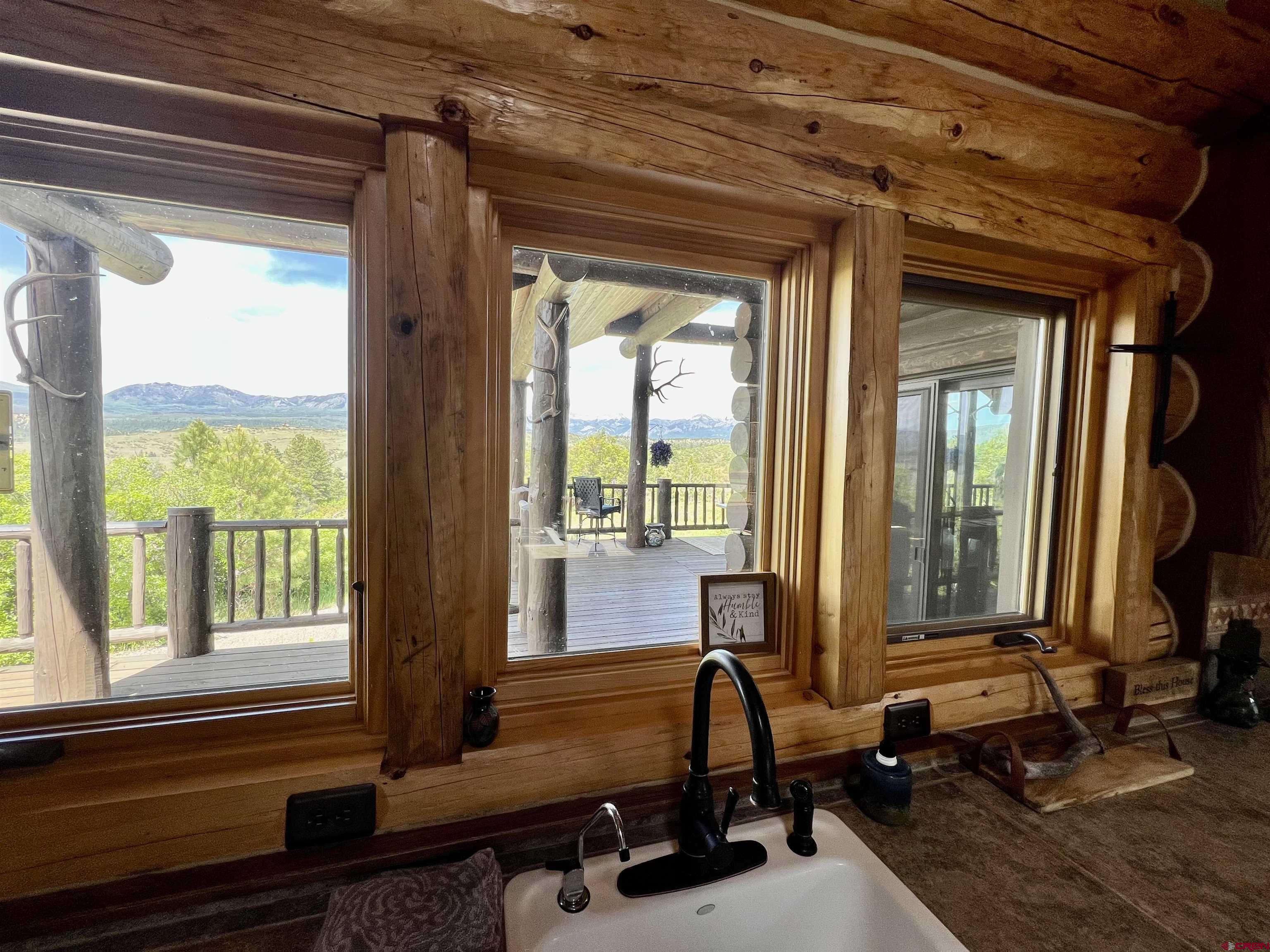 1329 B Spg Vly Rnch Road, Unit ELK HAVEN Chromo, CO 81128 - Photo 26 of 33 a room with patio furniture and windows