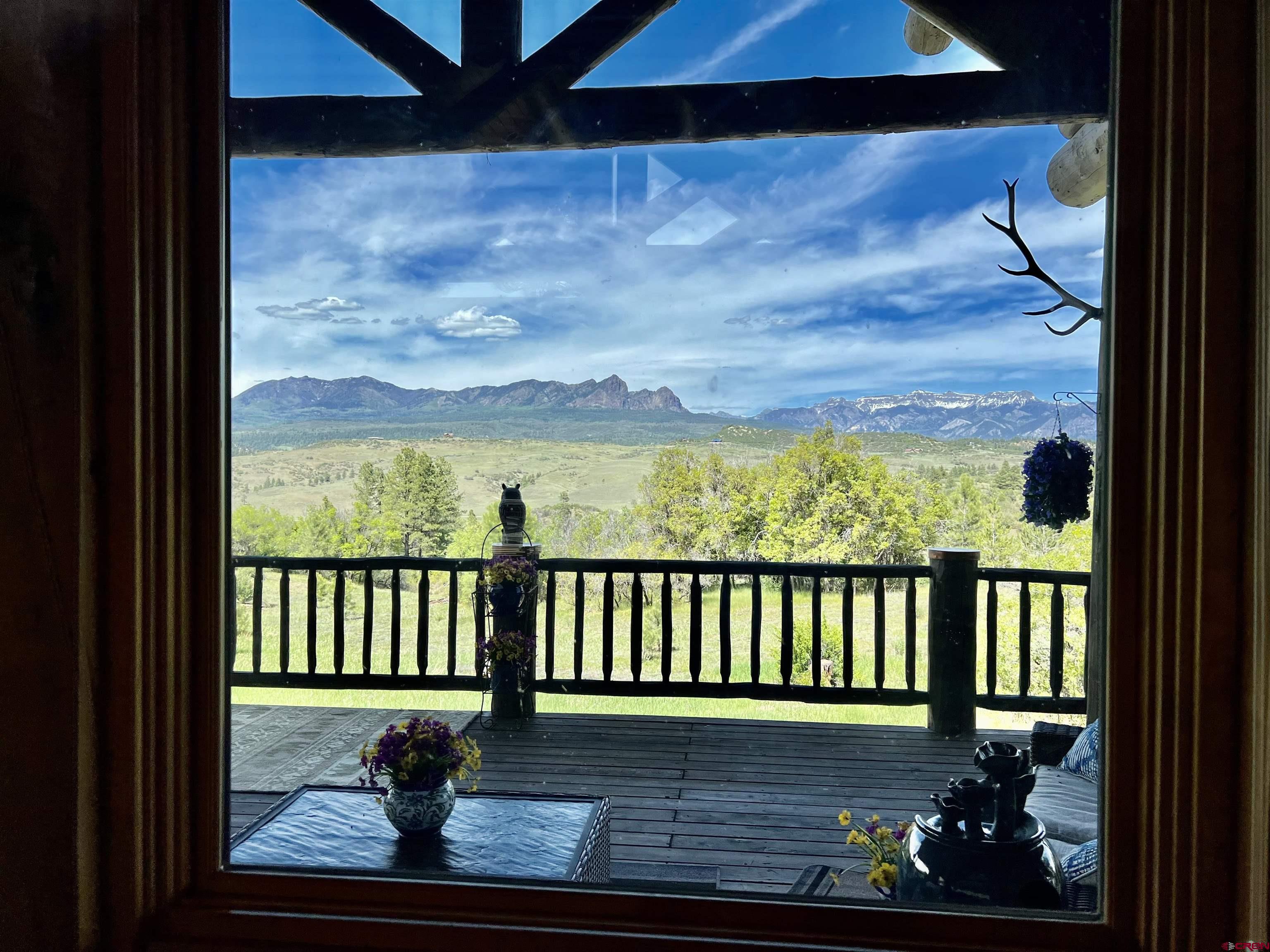 1329 B Spg Vly Rnch Road, Unit ELK HAVEN Chromo, CO 81128 - Photo 28 of 33 a view of a porch with a yard