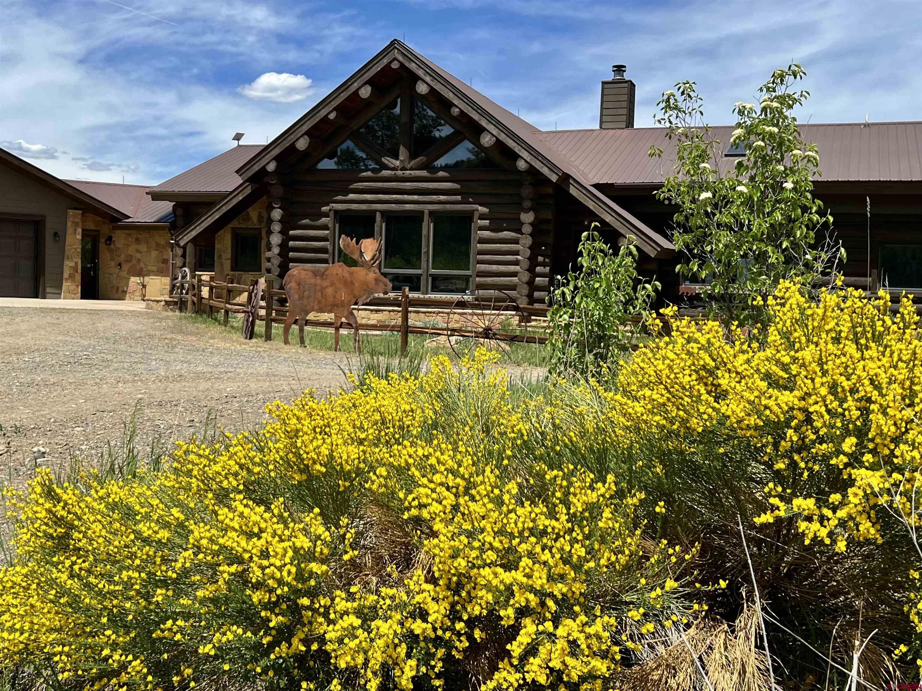 1329 B Spg Vly Rnch Road, Unit ELK HAVEN Chromo, CO 81128 - Photo 8 of 33 front view of a house with a small yard
