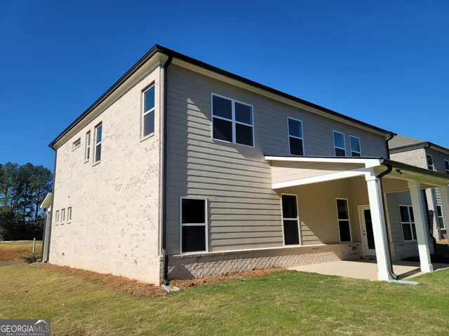 a front view of a house with garage