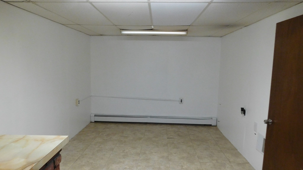 414 Cedar Street Dedham, MA 02026 - Photo 24 of 24 a view of a room with racks on the wall