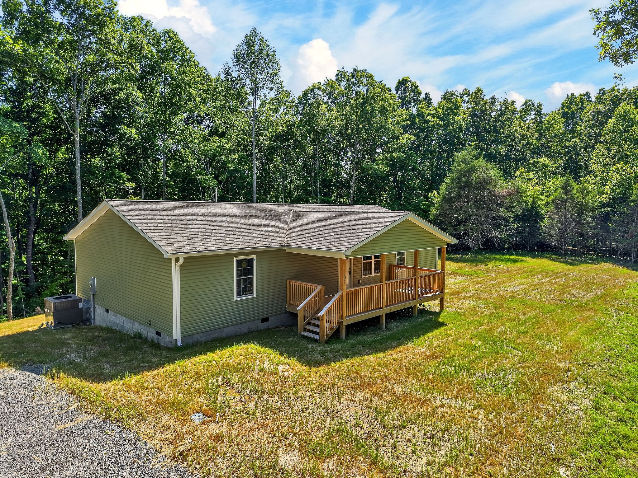 1053 Benton Tidwell Road Hilham, TN 38568 - Photo 33 of 39 a view of a house with a yard and sitting area