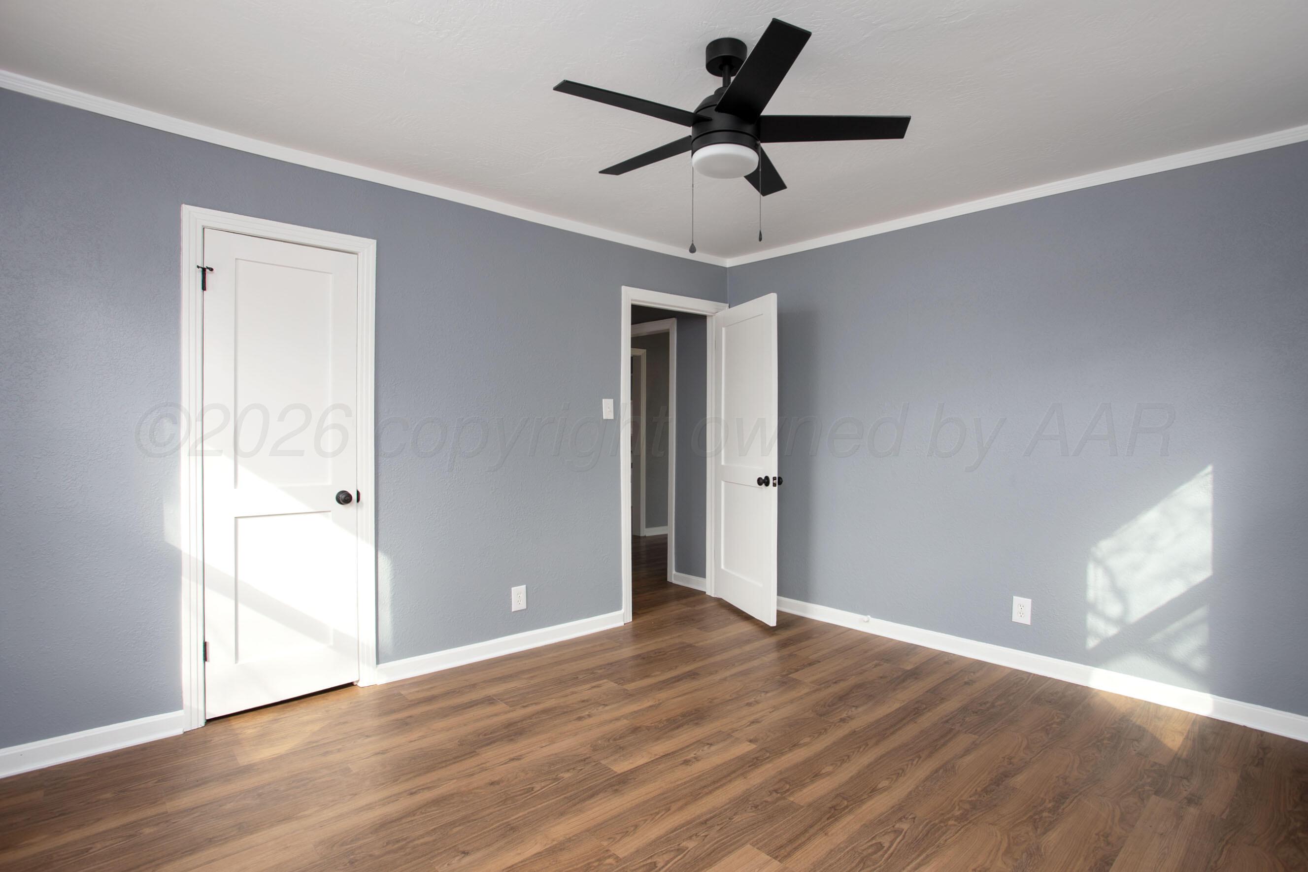 4815 Southwest 10th Avenue Amarillo, TX 79106 - Photo 15 of 21 a view of an empty room and wooden floor