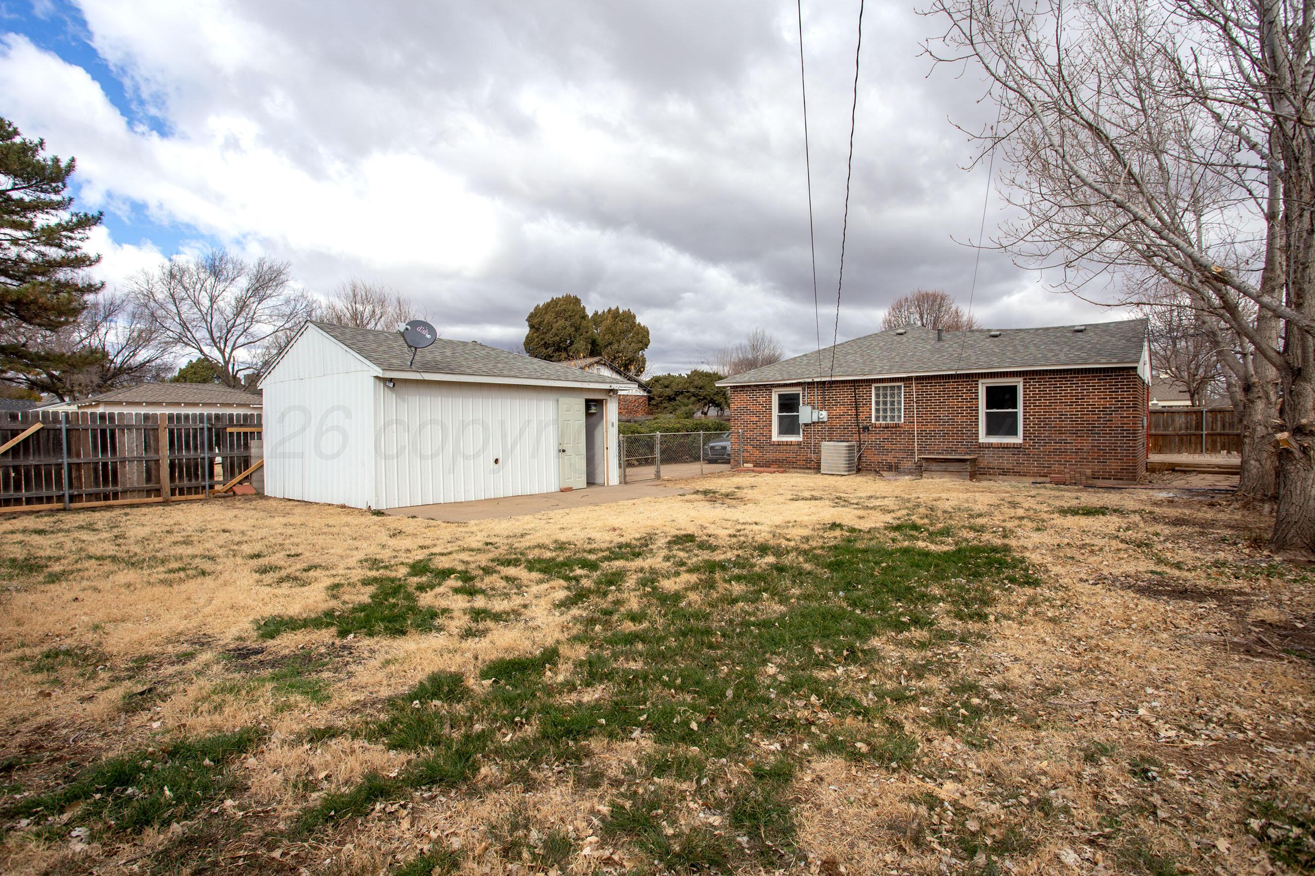 4815 Southwest 10th Avenue Amarillo, TX 79106 - Photo 19 of 21 a front view of a house with garden