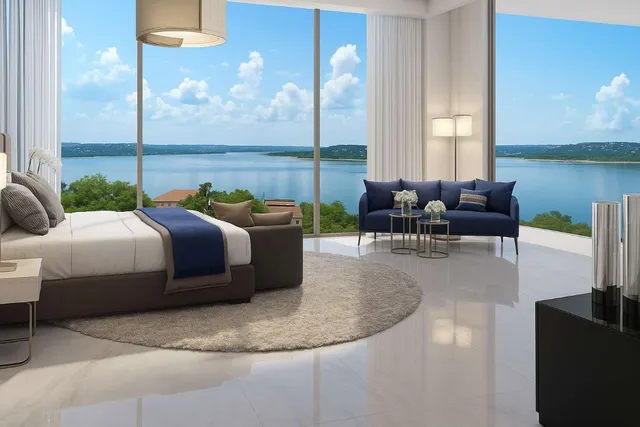 an aerial view of a residential houses with outdoor space and lake view