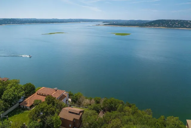 a kitchen with a sink and a stove top oven