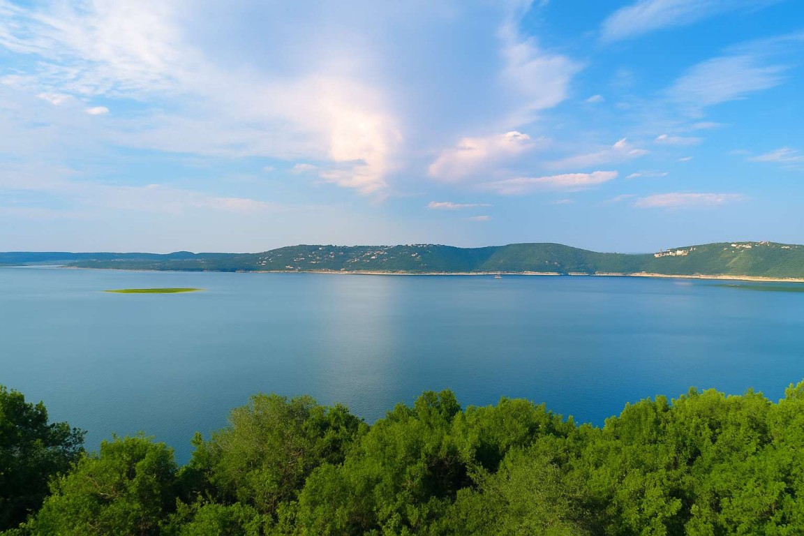 5006 Marshall Ford Road Austin, TX 78732 - Photo 40 of 40 a view of a lake with houses in the back