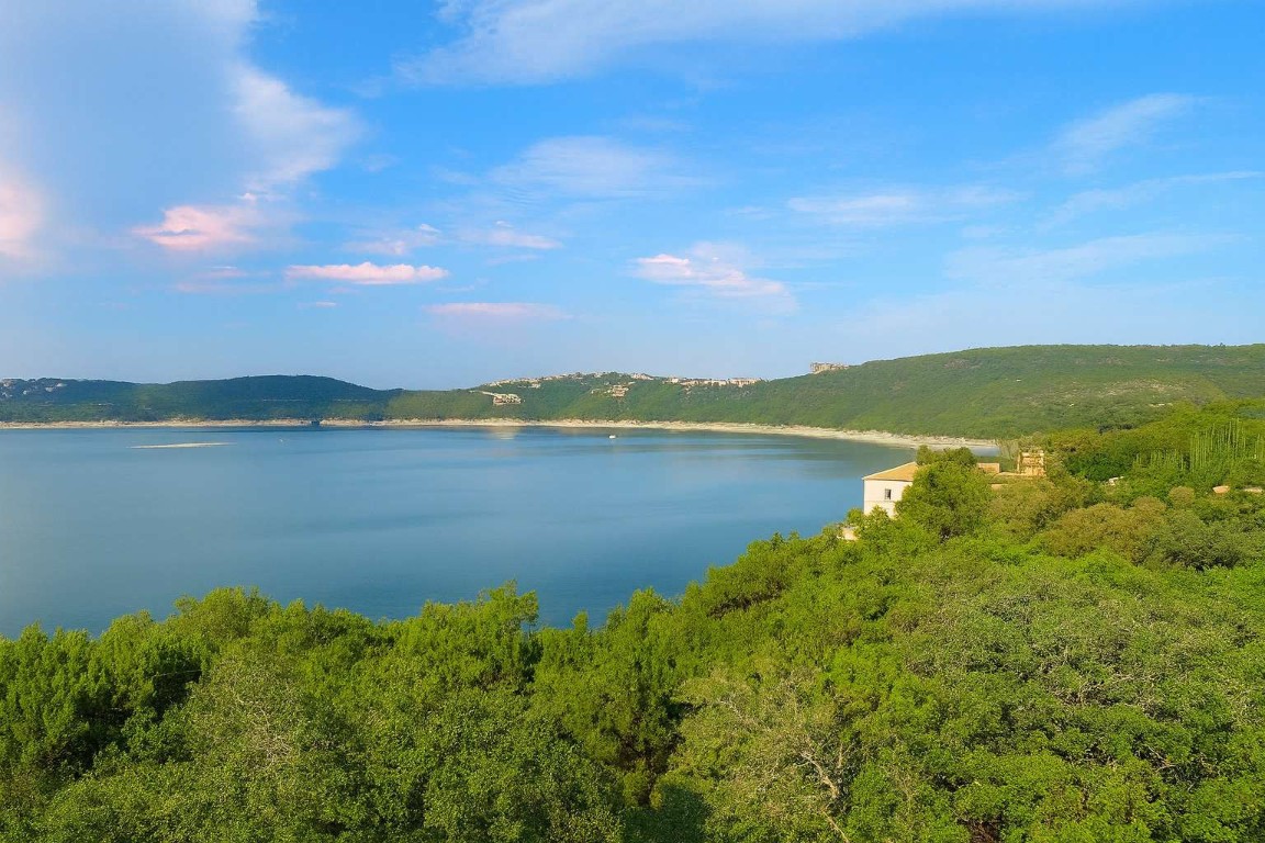 5006 Marshall Ford Road Austin, TX 78732 - Photo 4 of 40 a view of a lake with houses in the back