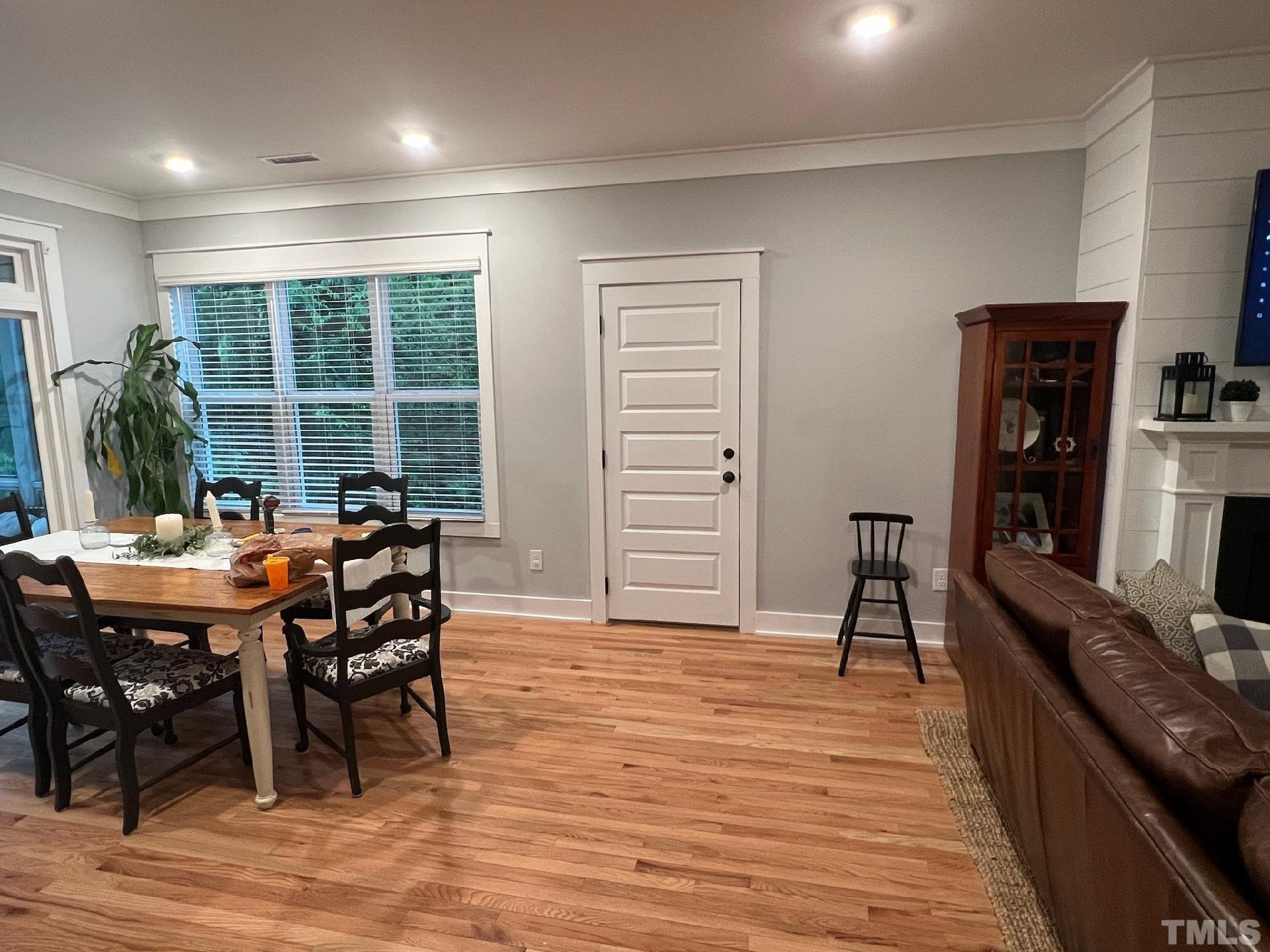 1417 Battery Drive Raleigh, NC 27610 - Photo 13 of 34 a view of a dining room with furniture and a floor to ceiling window