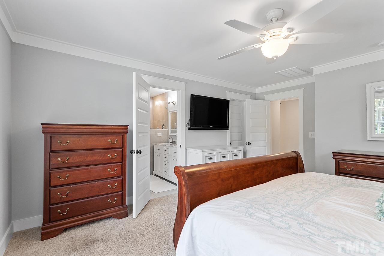 1417 Battery Drive Raleigh, NC 27610 - Photo 21 of 34 a bedroom with a bed and a flat screen tv