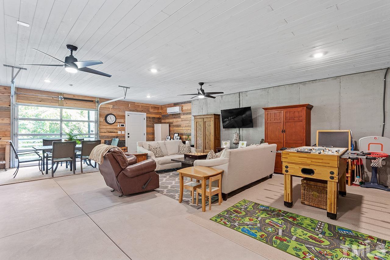 1417 Battery Drive Raleigh, NC 27610 - Photo 27 of 34 a living room with furniture and a flat screen tv
