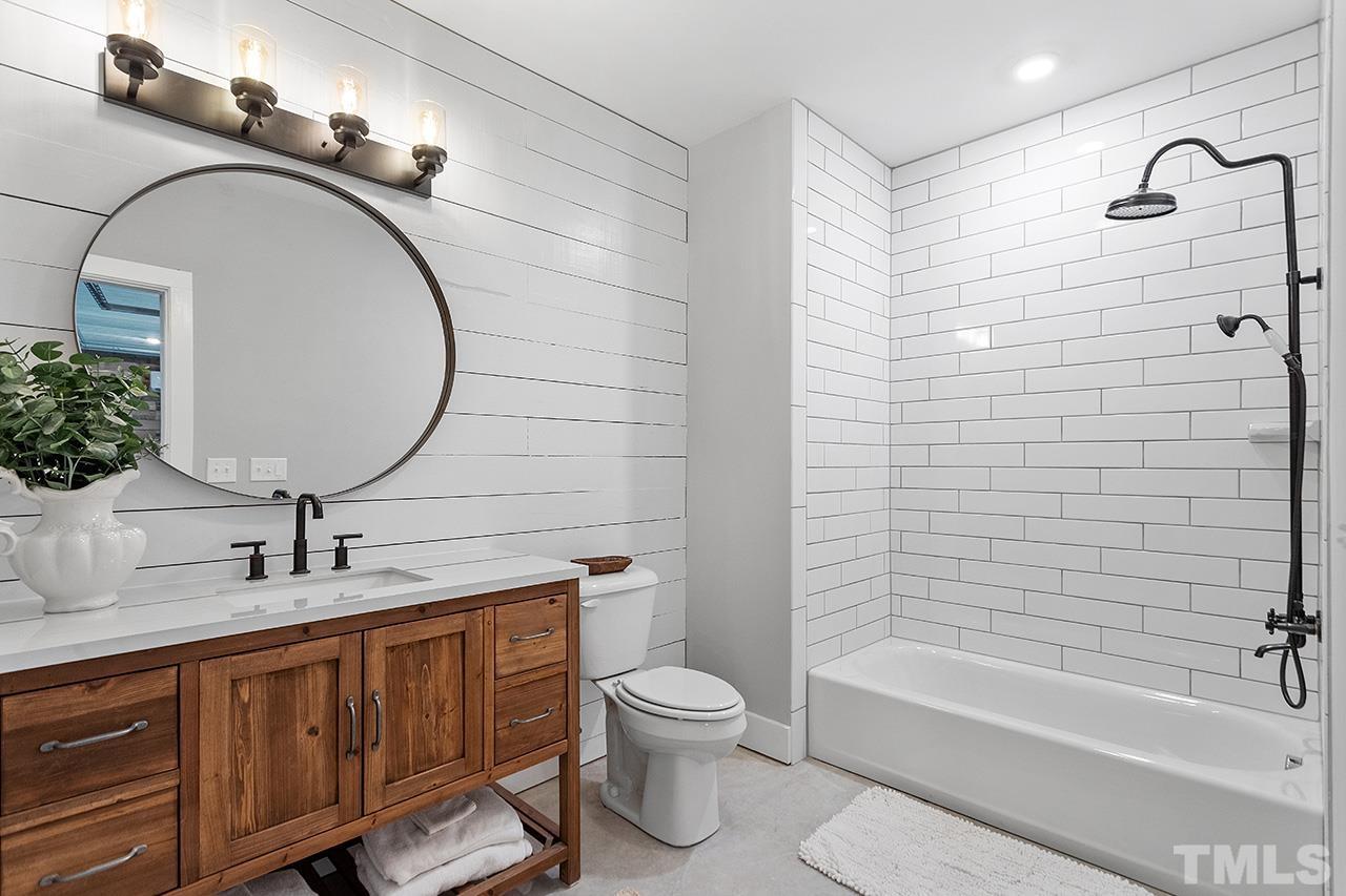 1417 Battery Drive Raleigh, NC 27610 - Photo 30 of 34 a bathroom with a toilet sink and bathtub