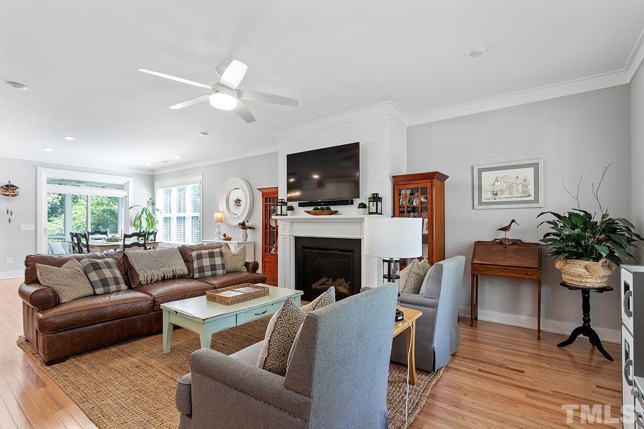 1417 Battery Drive Raleigh, NC 27610 - Photo 8 of 34 a living room with furniture a flat screen tv and a fireplace
