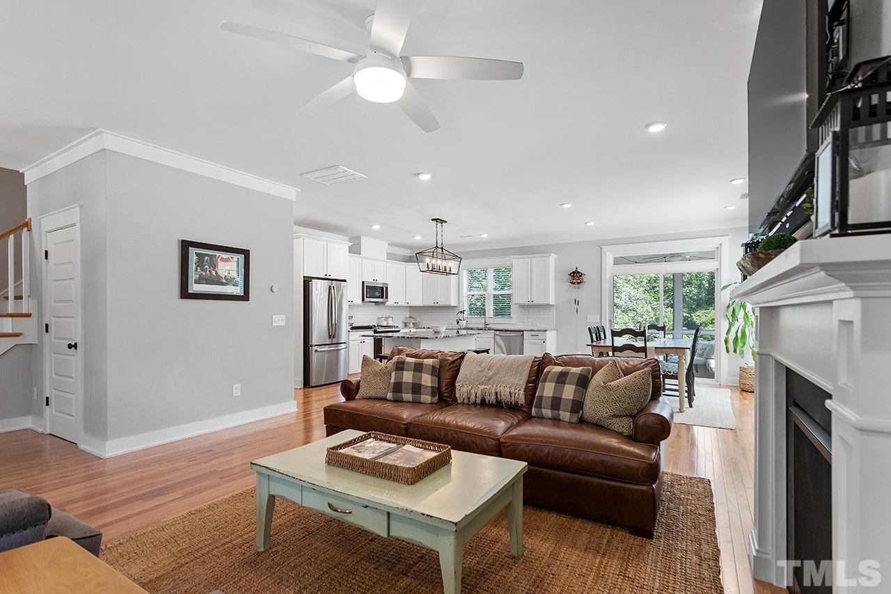 1417 Battery Drive Raleigh, NC 27610 - Photo 10 of 34 a living room with furniture a fireplace and a flat screen tv