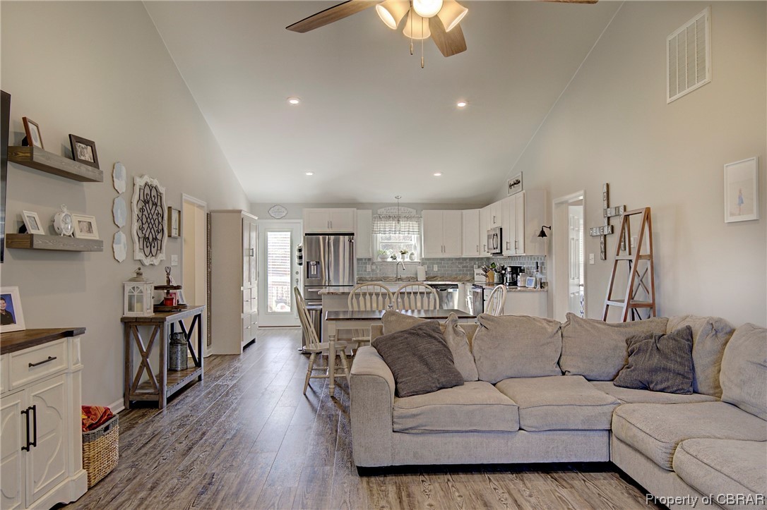 4944 Chestnut Fork Road Gloucester, VA 23061 - Photo 3 of 32 Living room with light hardwood / wood-style floors, high vaulted ceiling, ceiling fan, and sink
