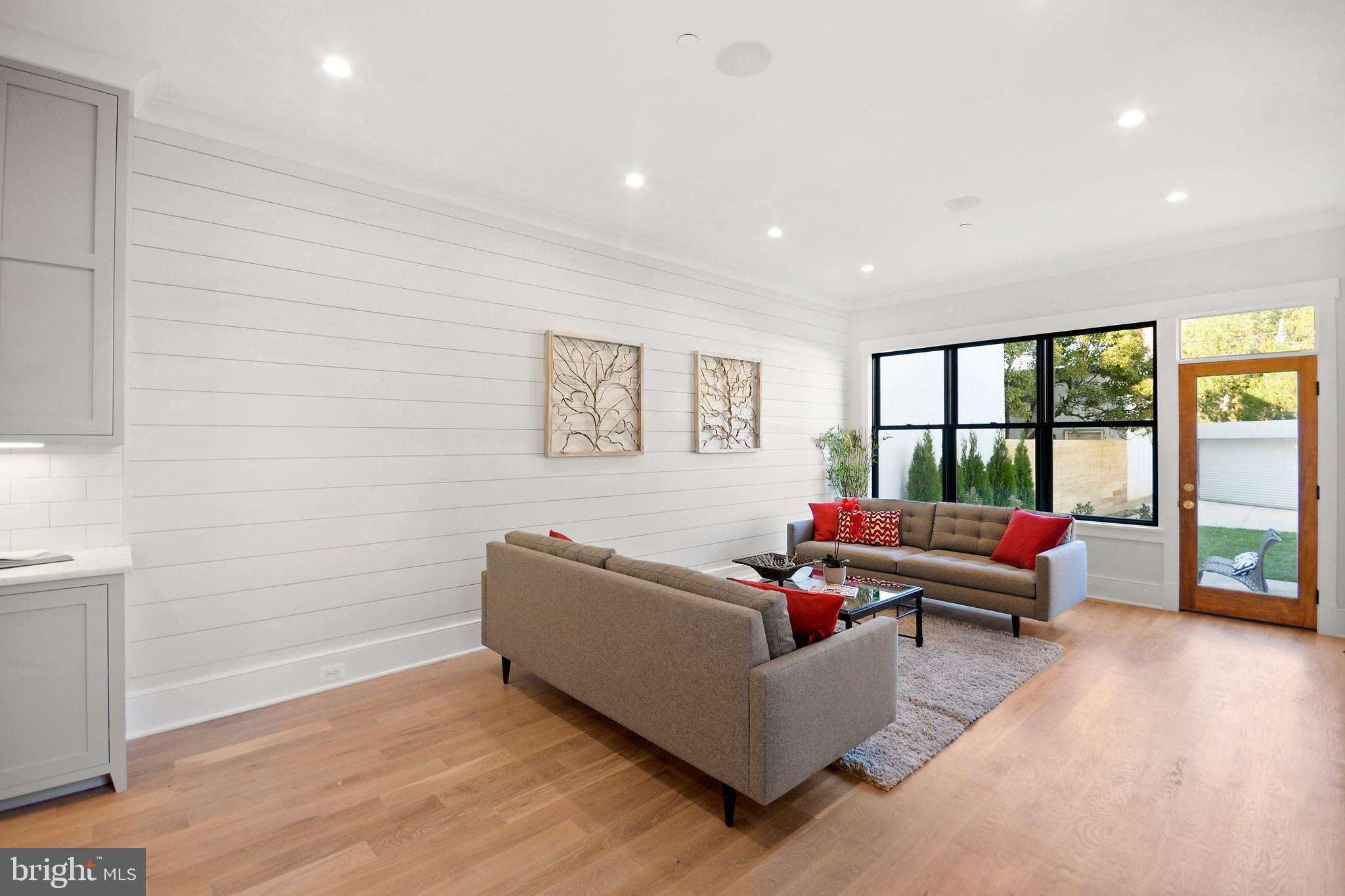 1432 G Street Southeast Washington, DC 20003 - Photo 10 of 35 a living room with furniture and a large window