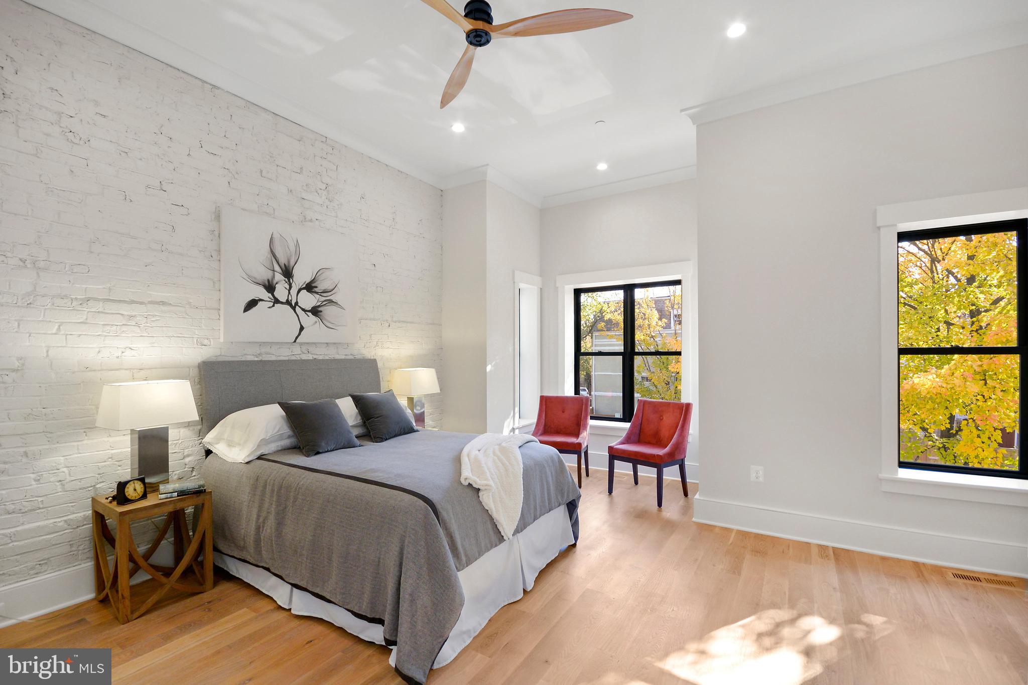 1432 G Street Southeast Washington, DC 20003 - Photo 14 of 35 a bedroom with a bed and a chair