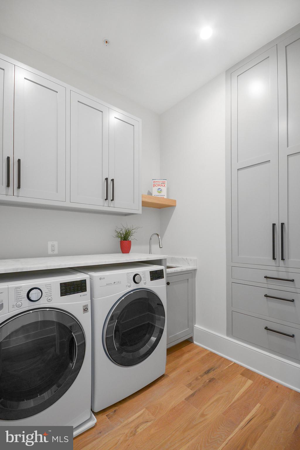 1432 G Street Southeast Washington, DC 20003 - Photo 17 of 35 a utility room with sink dryer and washer