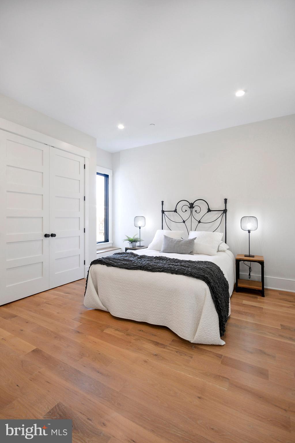 1432 G Street Southeast Washington, DC 20003 - Photo 18 of 35 a bedroom with a bed and a night stand