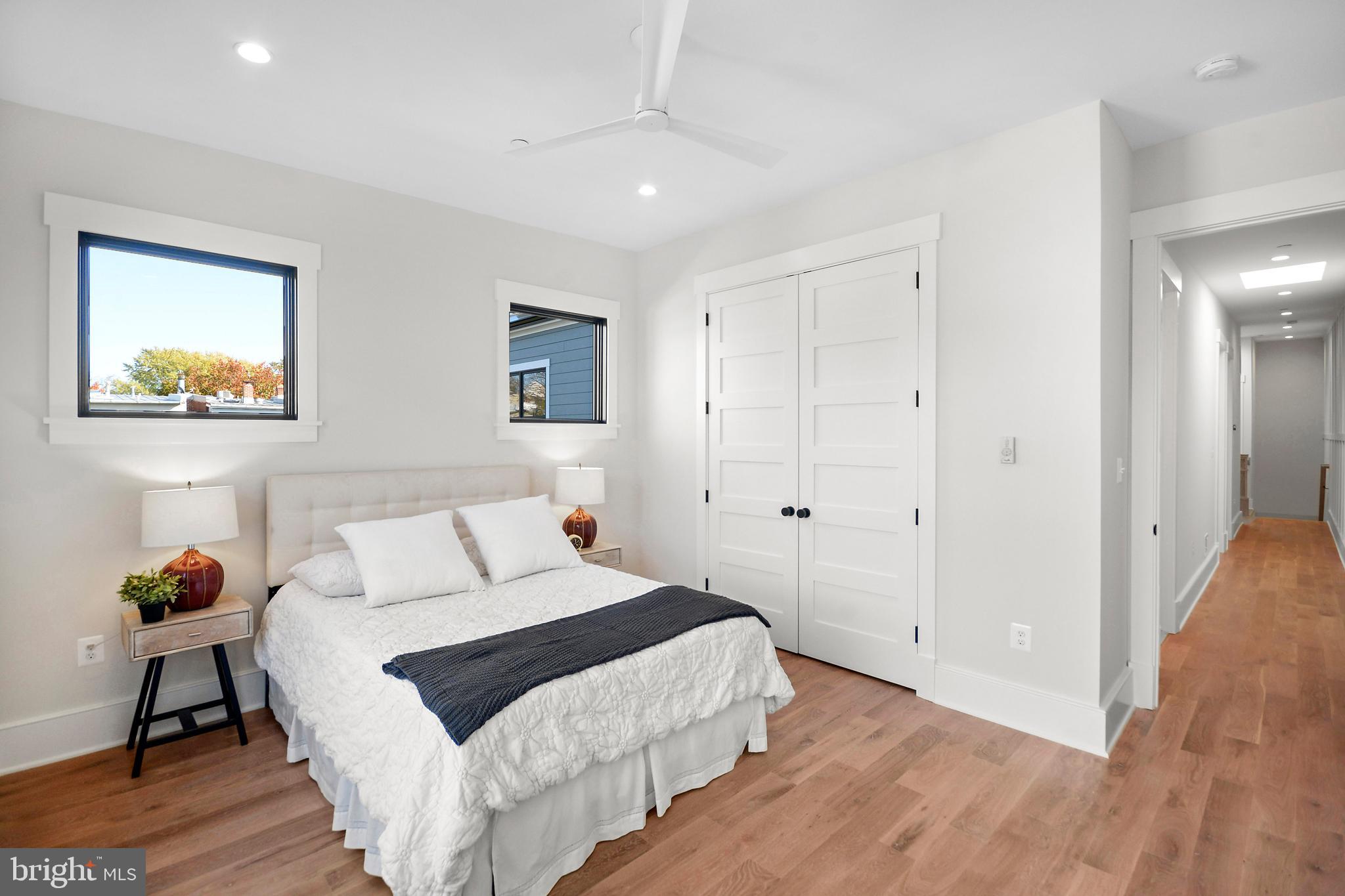 1432 G Street Southeast Washington, DC 20003 - Photo 20 of 35 a bedroom with a bed and a chandelier