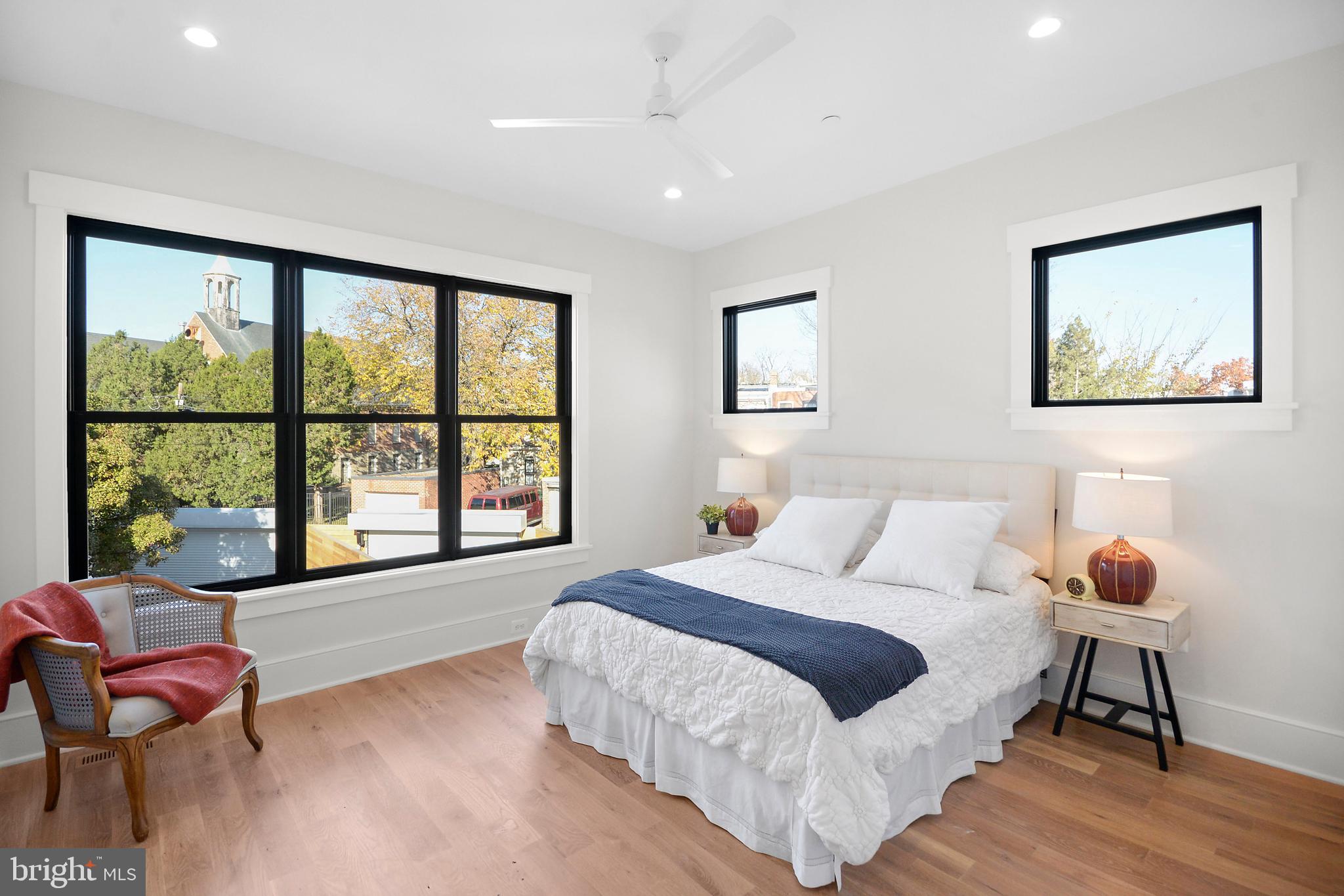 1432 G Street Southeast Washington, DC 20003 - Photo 21 of 35 a spacious bedroom with a bed and a large window