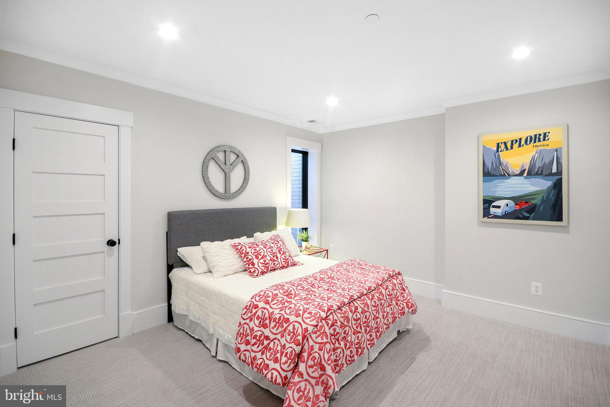 1432 G Street Southeast Washington, DC 20003 - Photo 25 of 35 a bedroom with a bed and painting on the wall