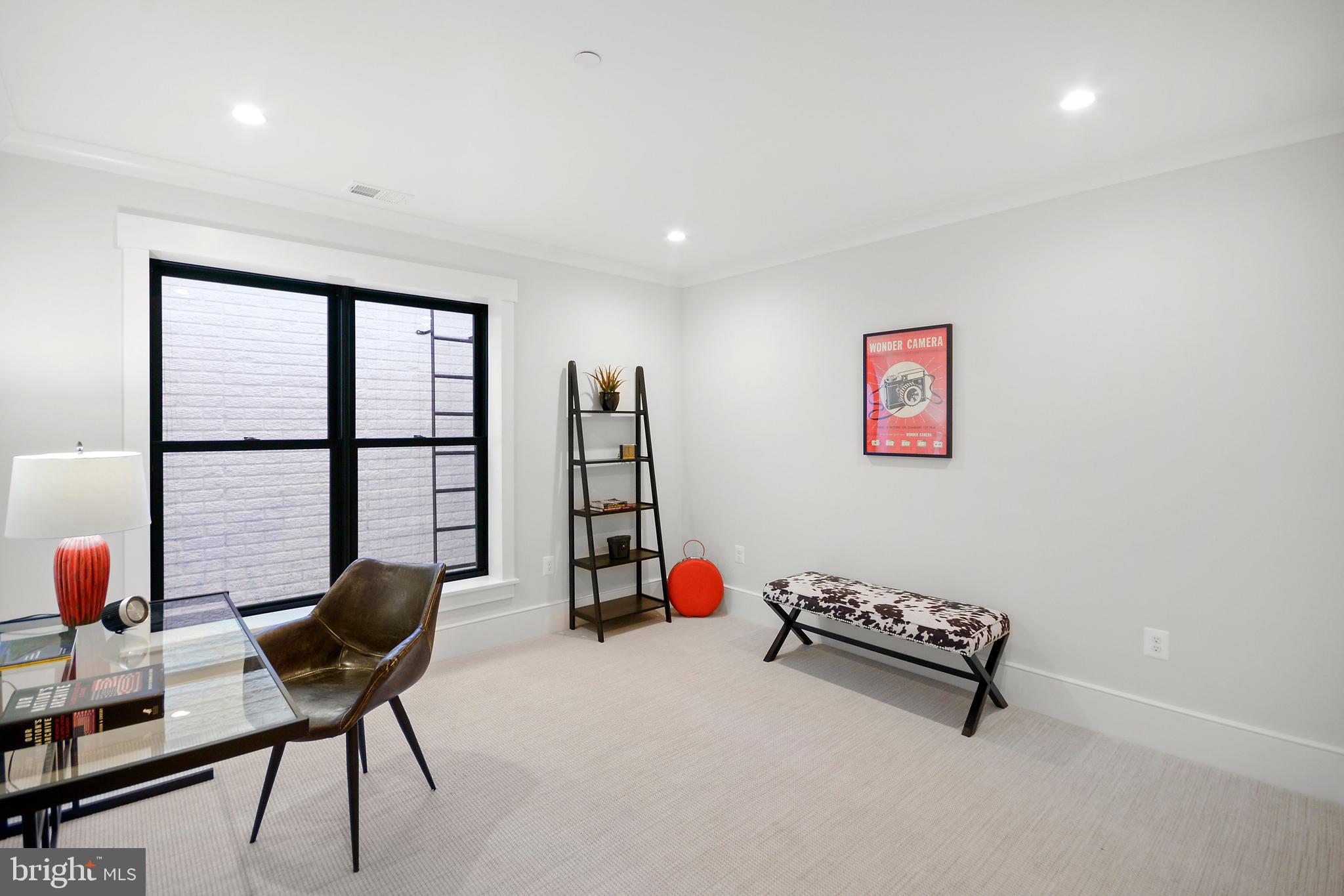 1432 G Street Southeast Washington, DC 20003 - Photo 27 of 35 a living room with furniture and a floor to ceiling window