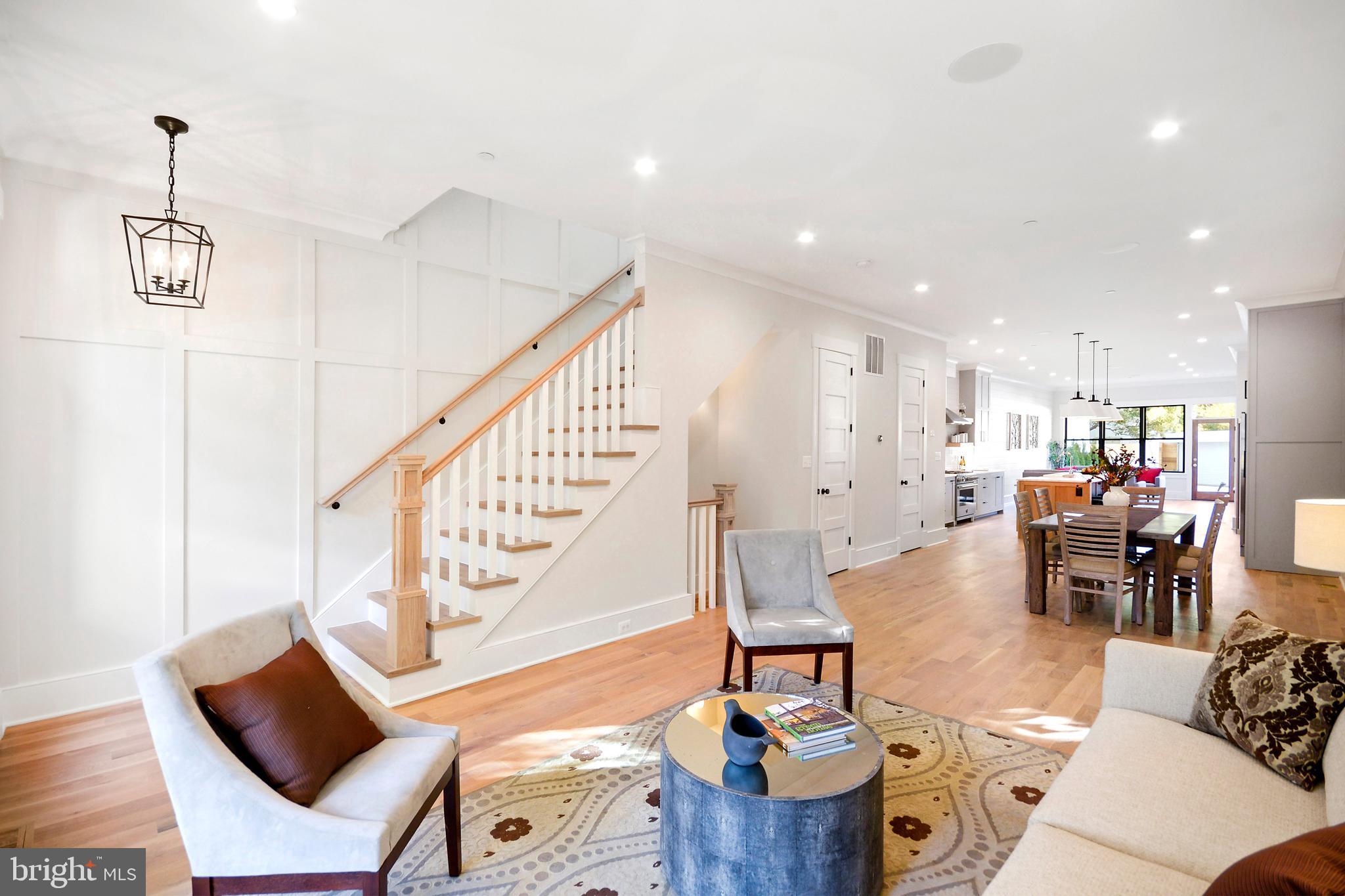 1432 G Street Southeast Washington, DC 20003 - Photo 3 of 35 a living room with furniture and a dining table with wooden floor