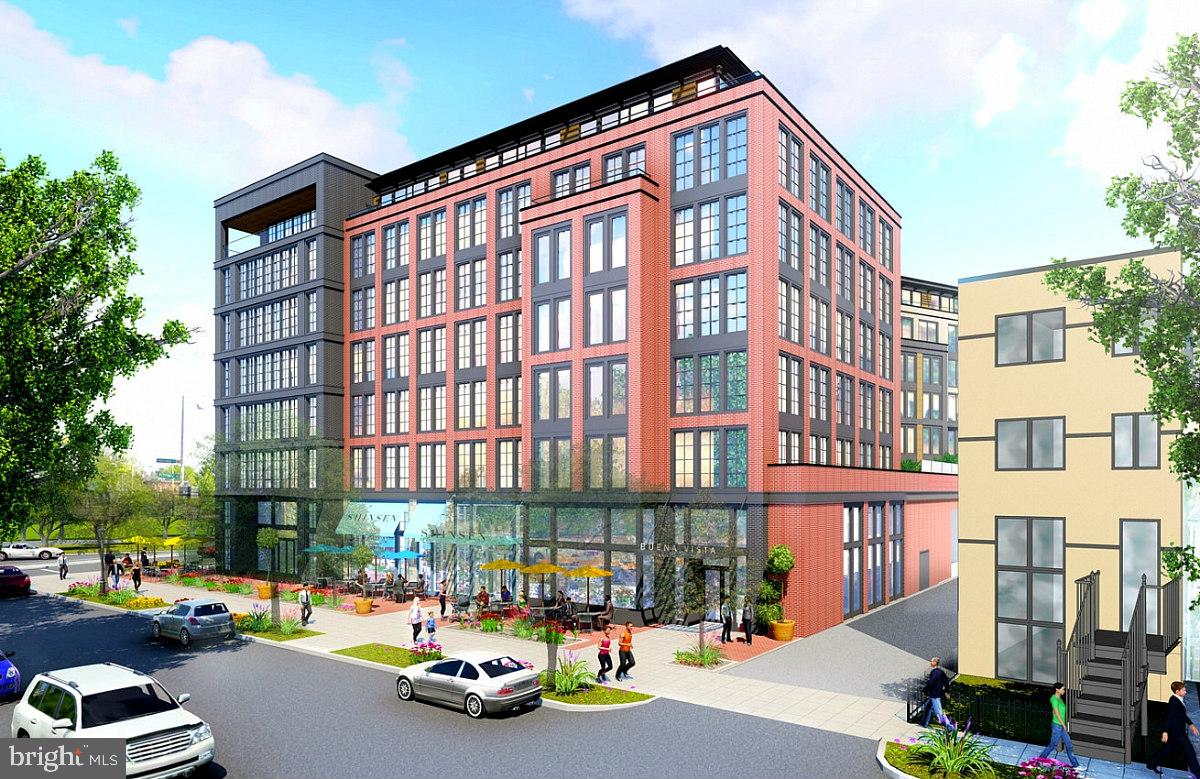 1432 G Street Southeast Washington, DC 20003 - Photo 33 of 35 a front view of a building with lot of cars and trees