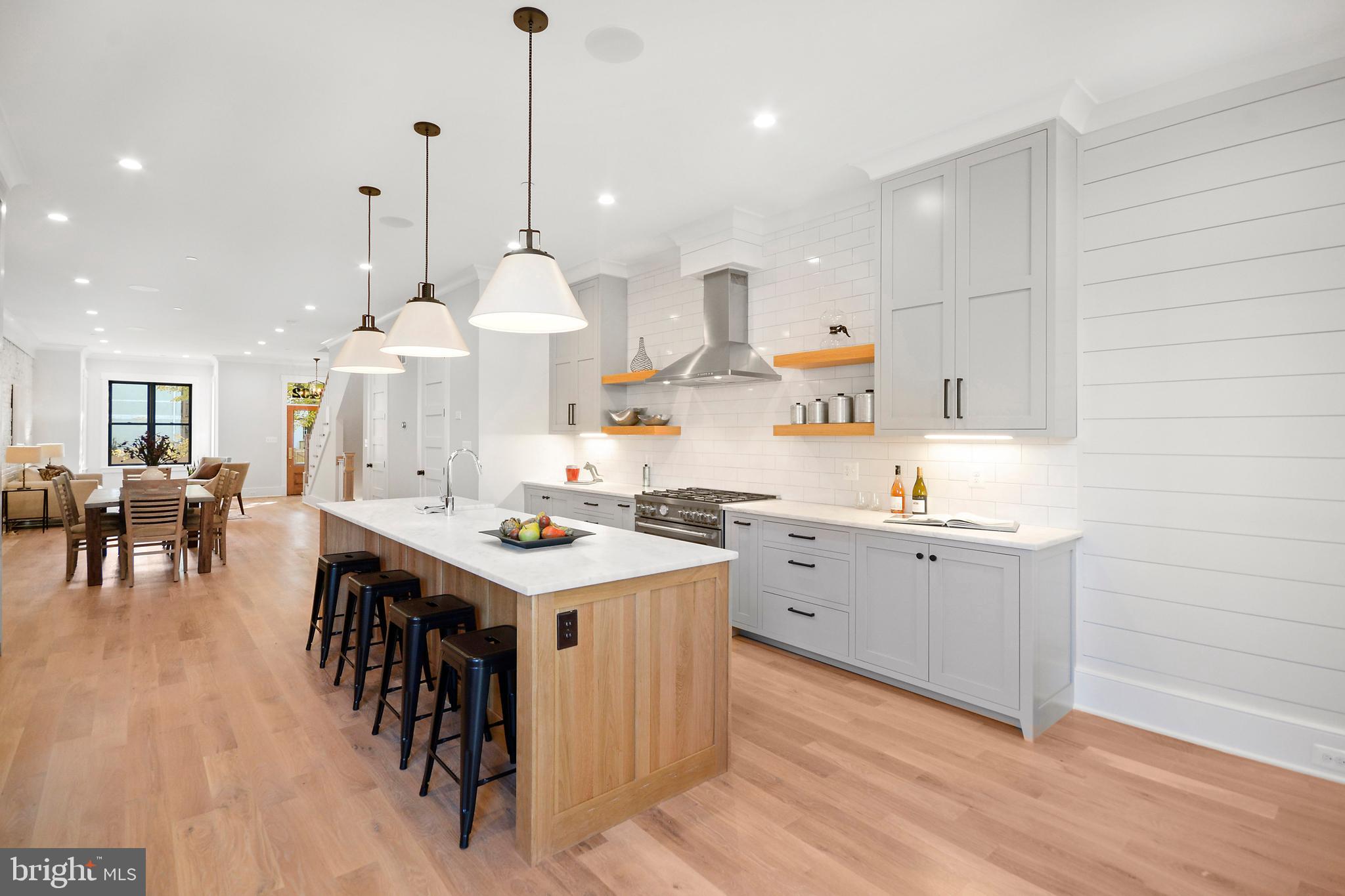 1432 G Street Southeast Washington, DC 20003 - Photo 9 of 35 a large kitchen with lots of counter space and furniture