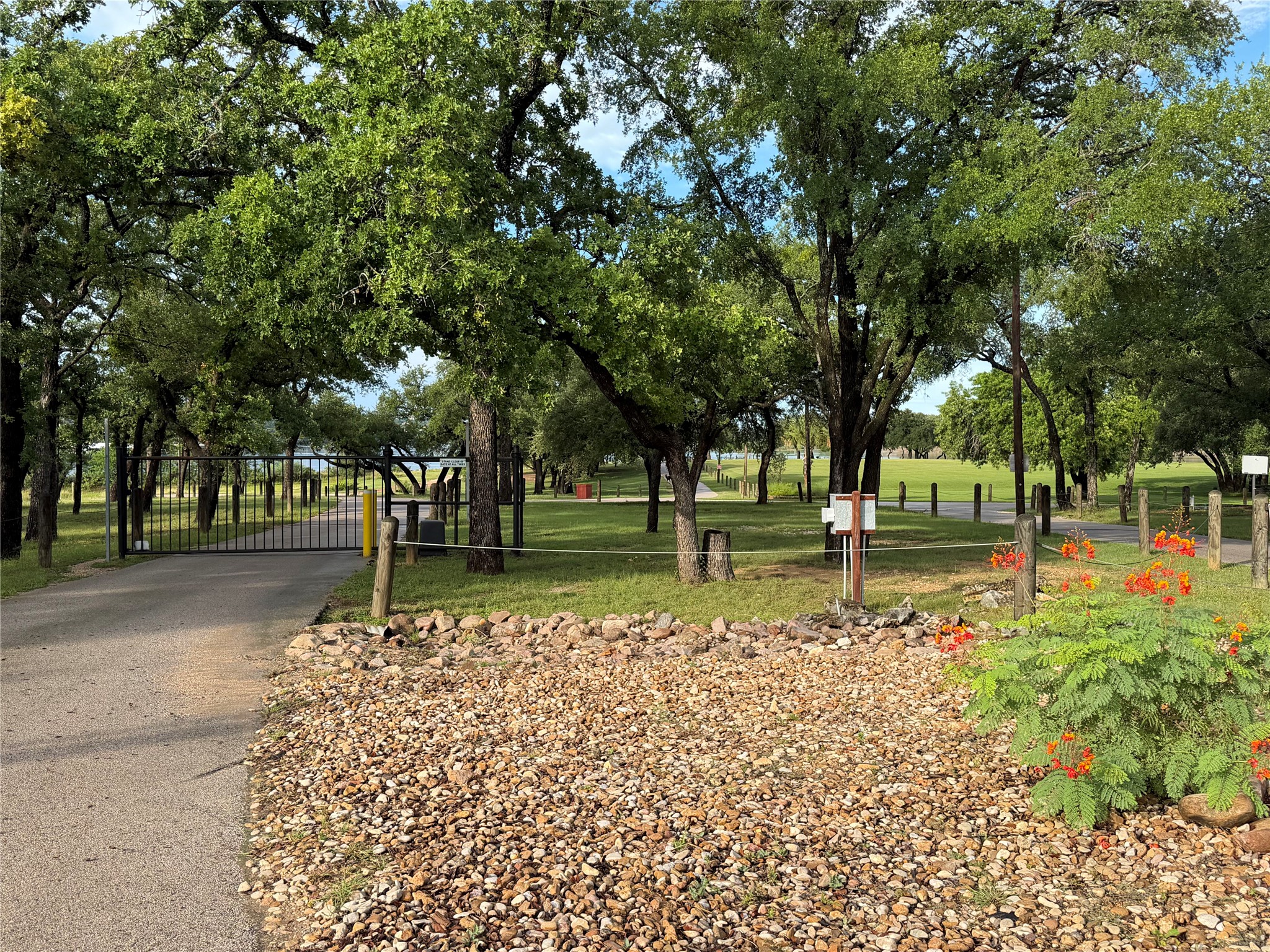 6701 Bar K Ranch Road Lago Vista, TX 78645 - Photo 8 of 15 Secure gated entry leads to LVPOA amenities