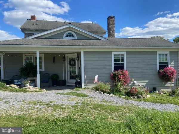 a front view of a house with a porch